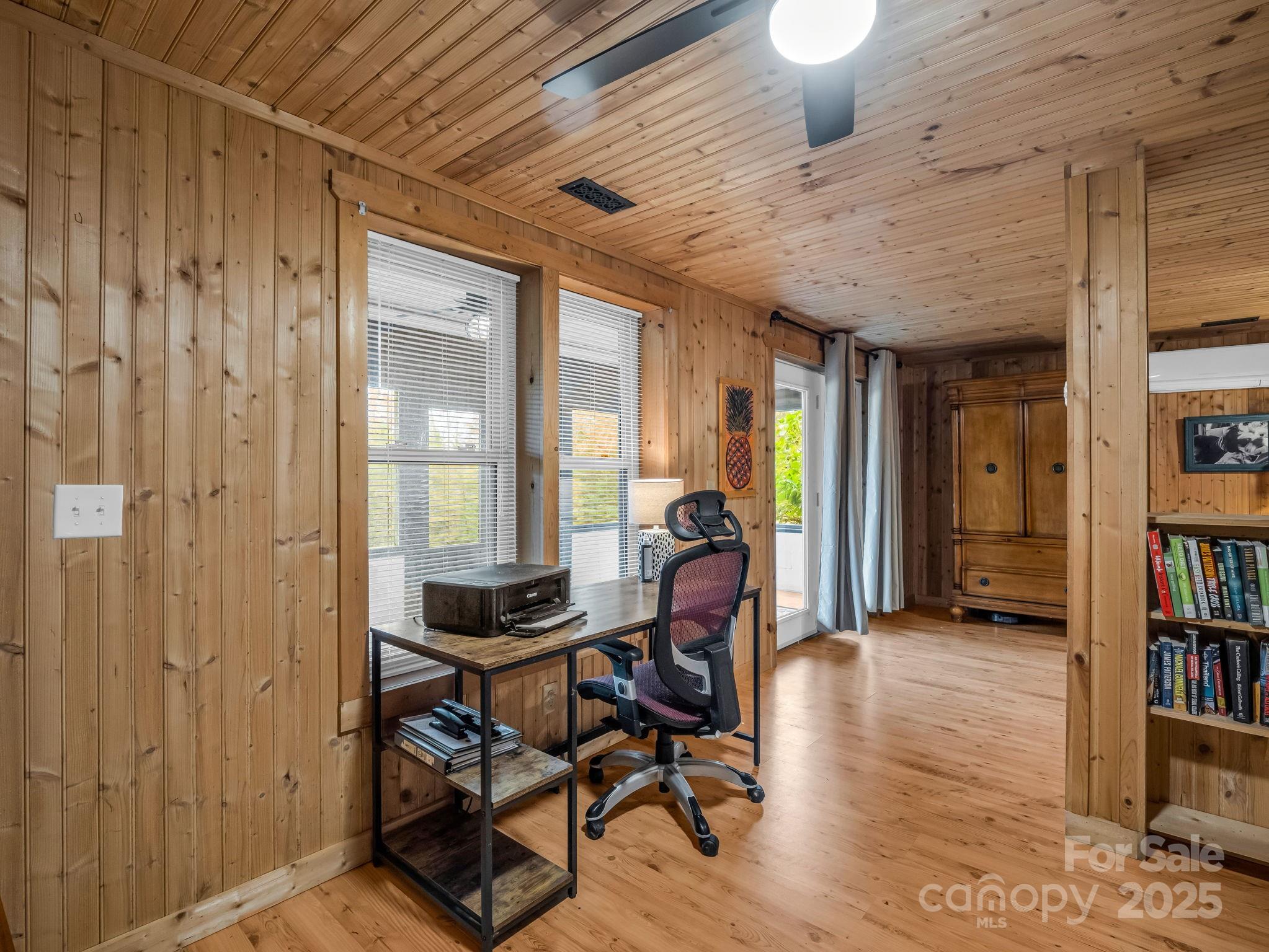 557 Emerald Parkway Rutherfordton, NC 28139 - Photo 27 of 48 a work room with furniture and a book shelf