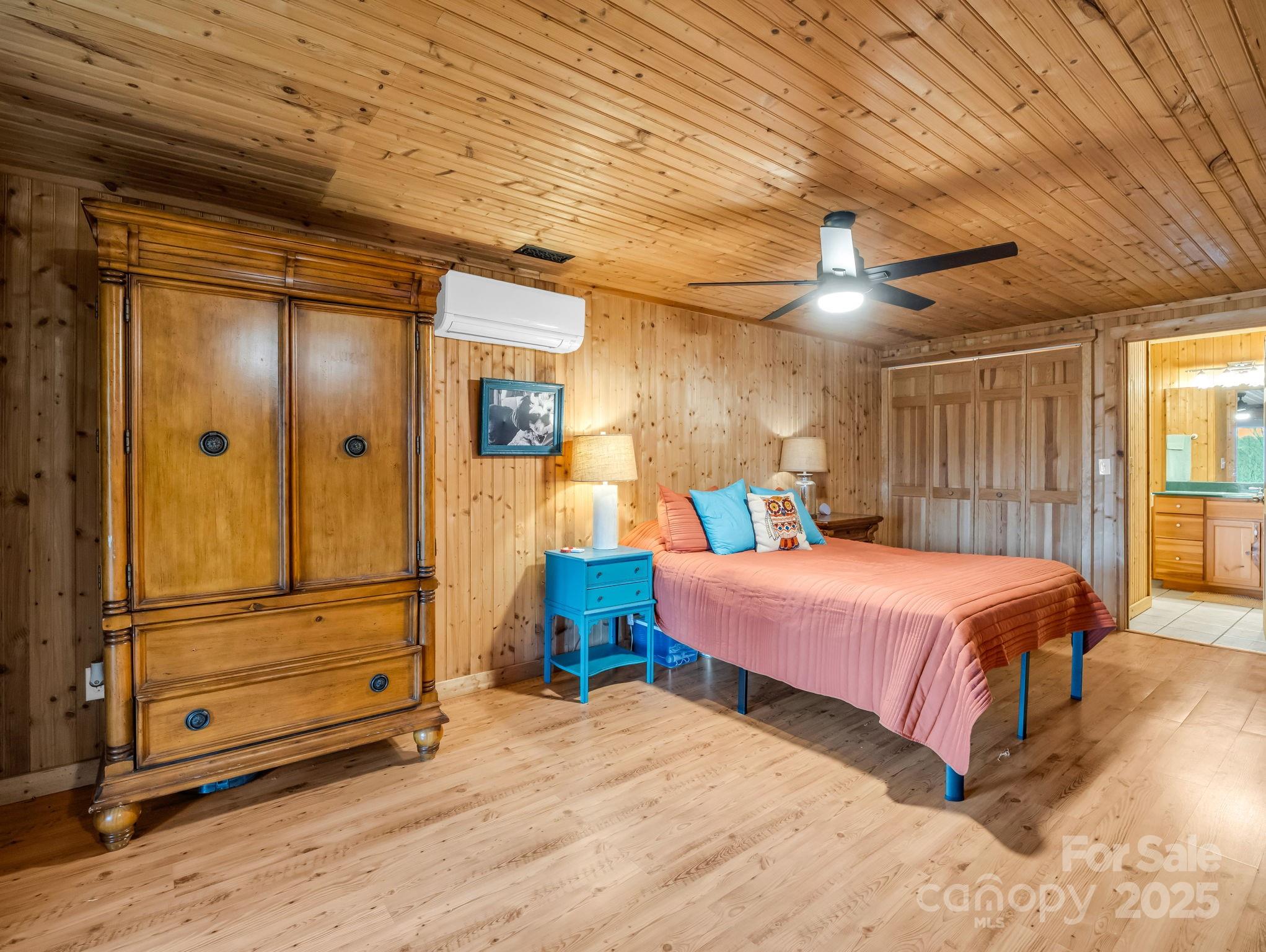 557 Emerald Parkway Rutherfordton, NC 28139 - Photo 28 of 48 a bedroom with a bed and a mirror