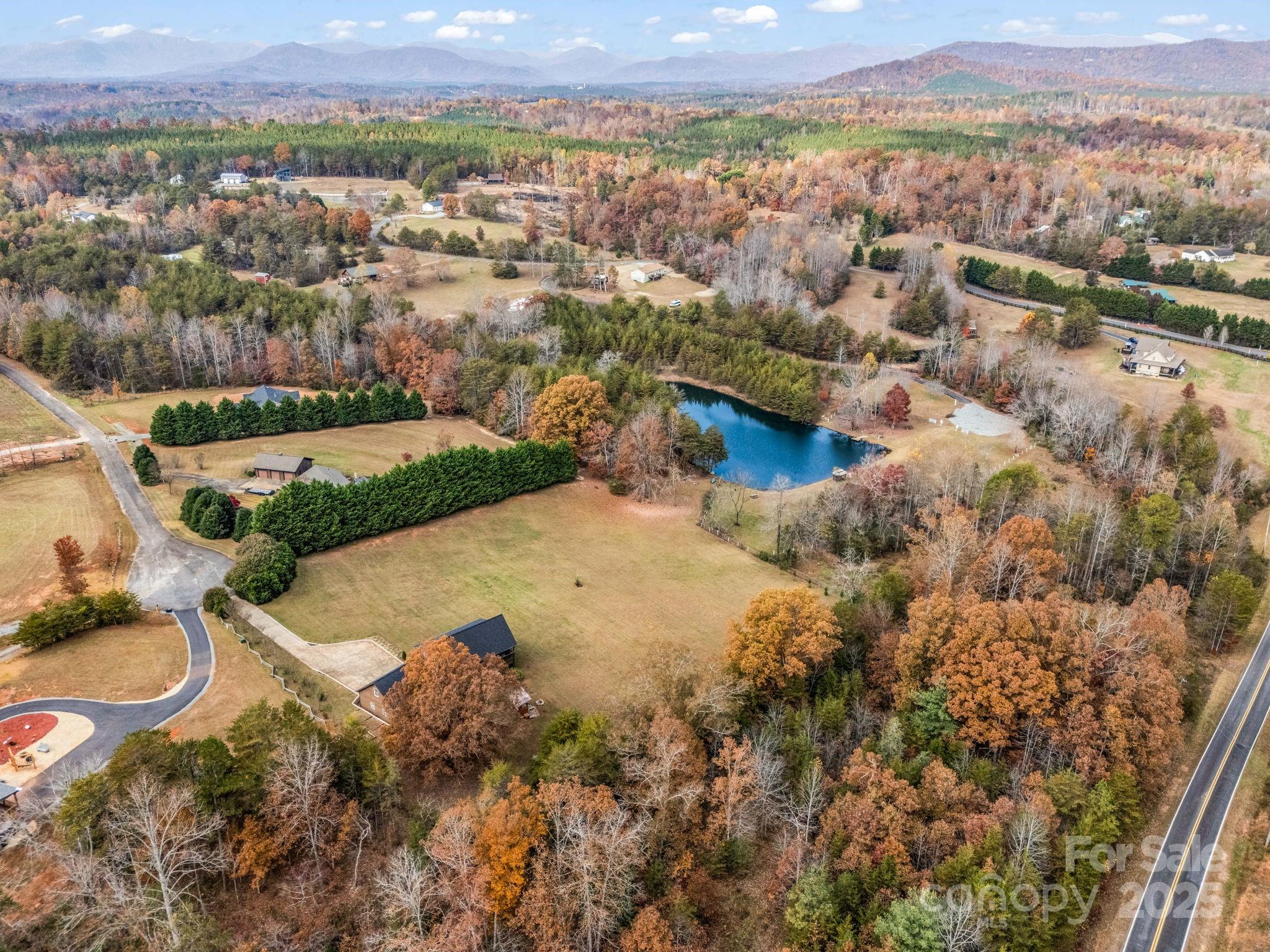 557 Emerald Parkway Rutherfordton, NC 28139 - Photo 3 of 48 an aerial view of residential houses with outdoor space and trees