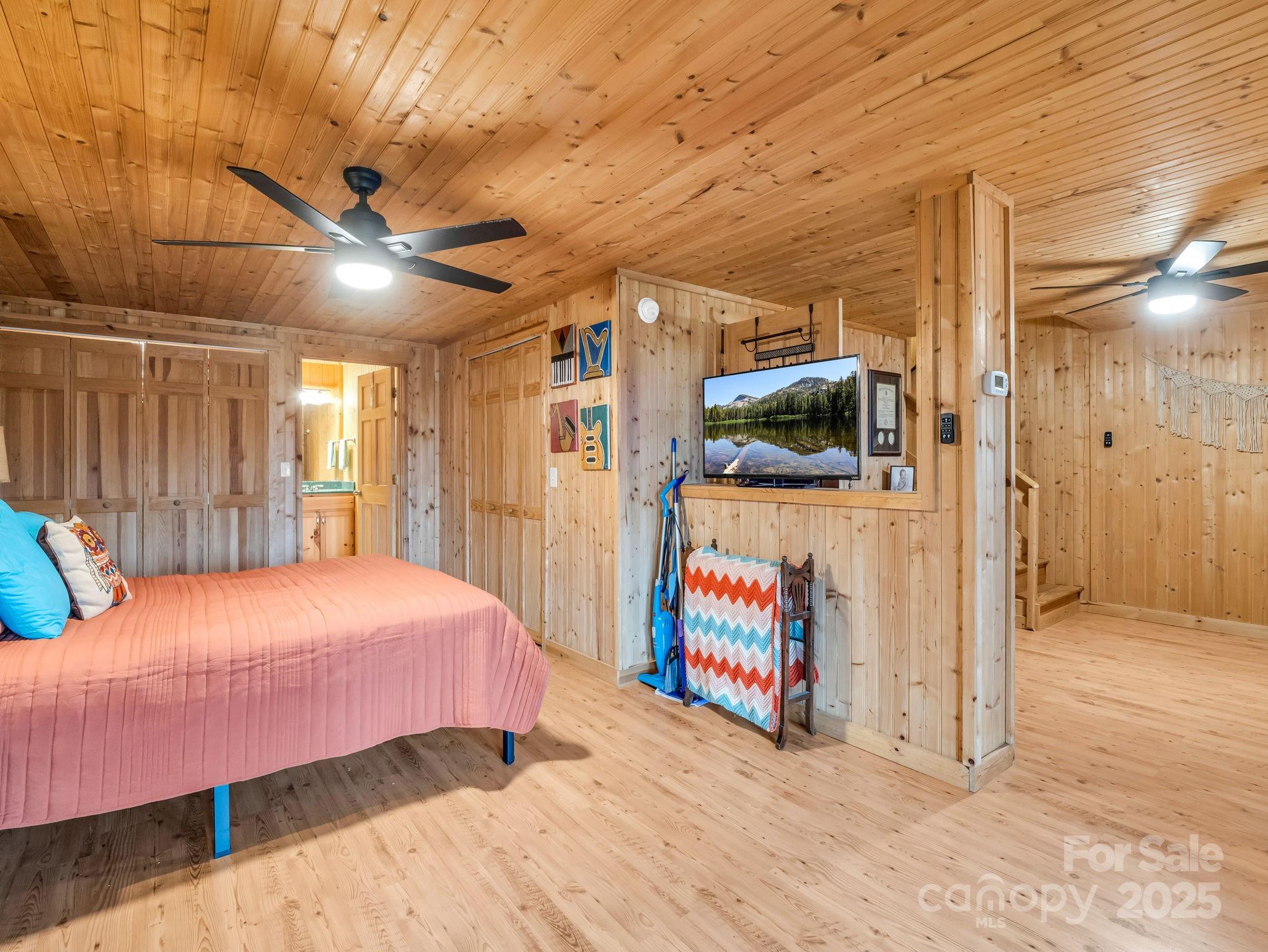 557 Emerald Parkway Rutherfordton, NC 28139 - Photo 32 of 48 a bedroom with a bed and a large mirror