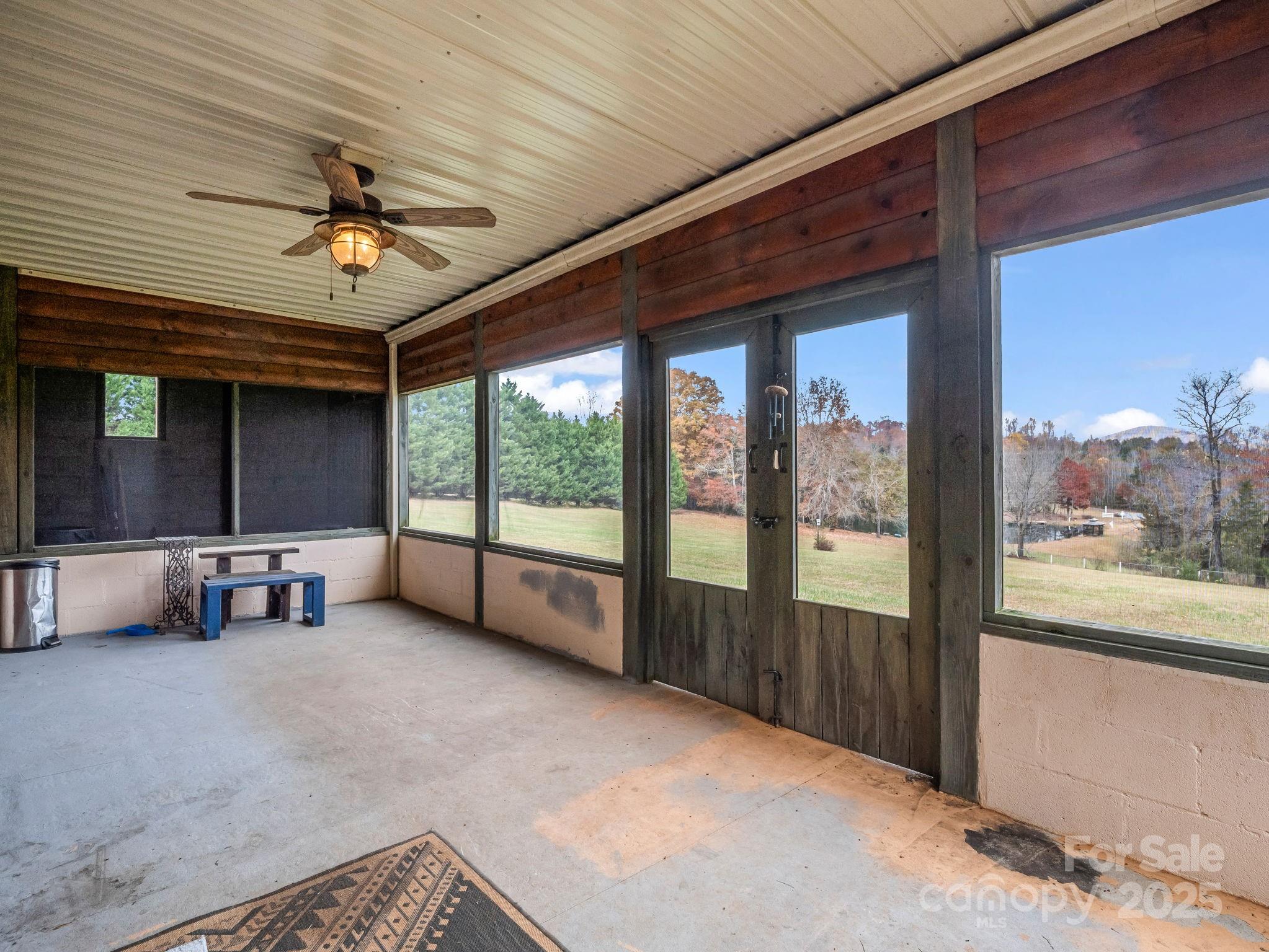 557 Emerald Parkway Rutherfordton, NC 28139 - Photo 36 of 48 a view of a livingroom with furniture and a ceiling fan