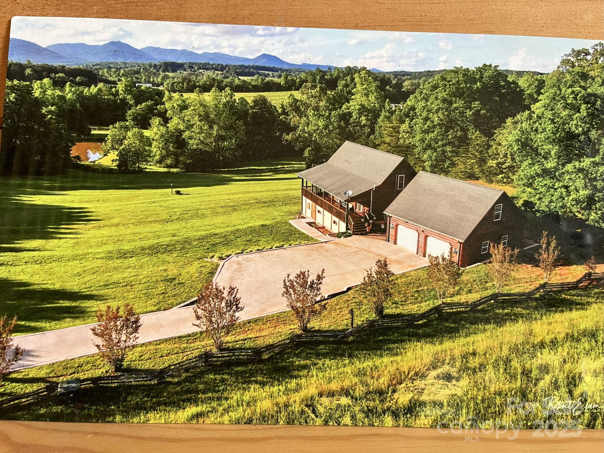 557 Emerald Parkway Rutherfordton, NC 28139 - Photo 4 of 48 a view of a lake with a mountain