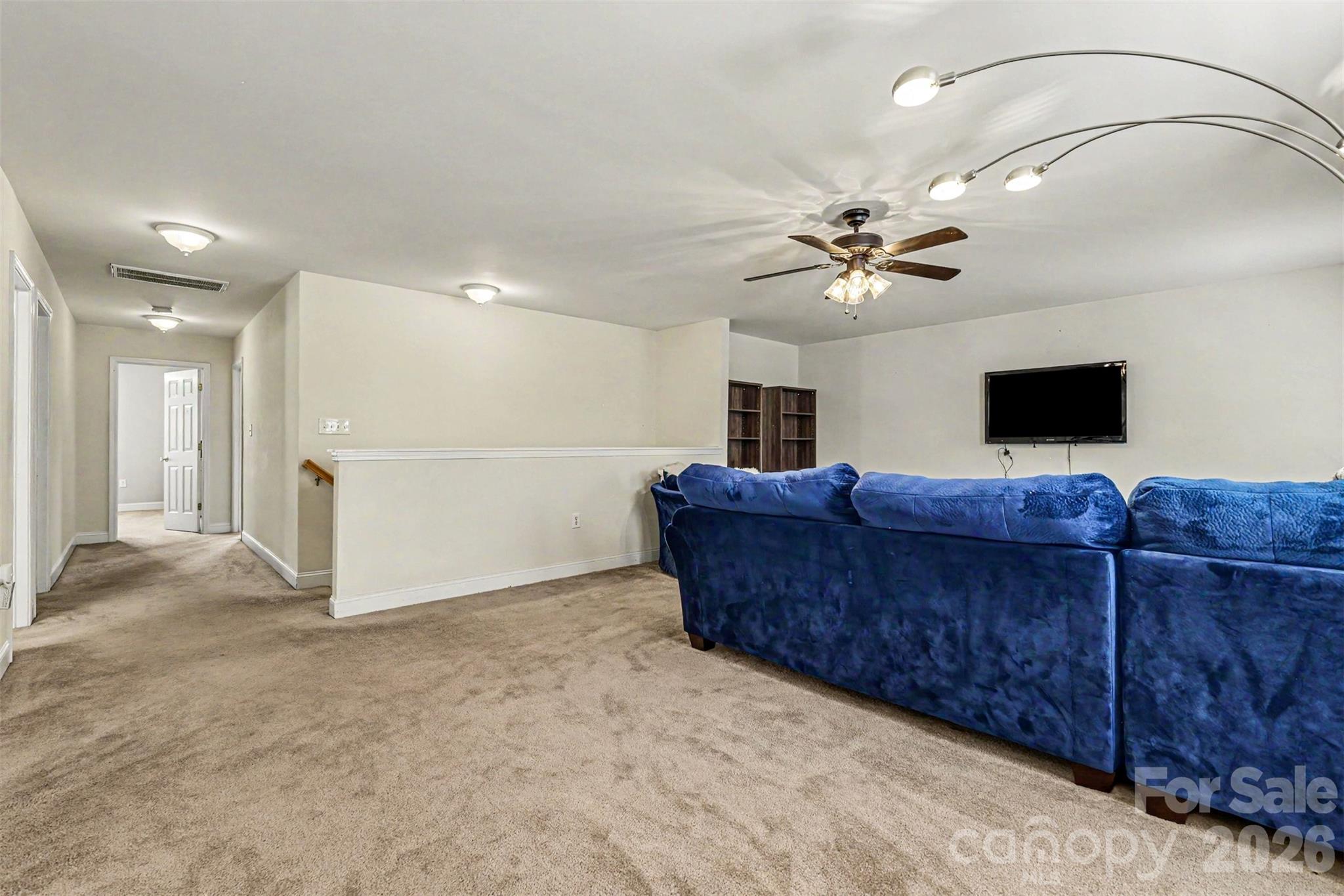 3035 Proverbs Court Monroe, NC 28110 - Photo 17 of 30 a living room with furniture and a ceiling fan
