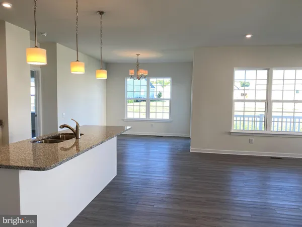 a kitchen with sink and window