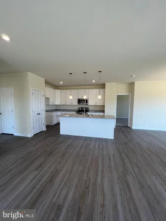 a view of kitchen and wooden floor