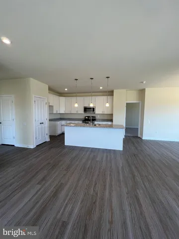 a view of kitchen and wooden floor