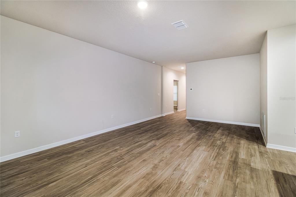 46 Ash Road Ocala, FL 34472 - Photo 5 of 20 a view of an empty room and wooden floor