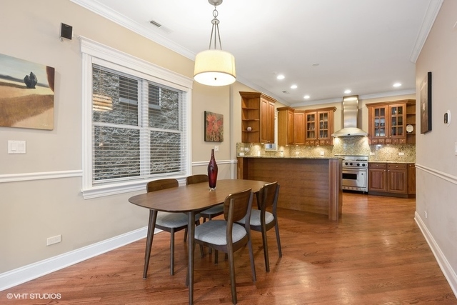 3535 North Reta Avenue, Unit 2 Chicago, IL 60657 - Photo 5 of 12 a dinning room and kitchen with a decorative lights