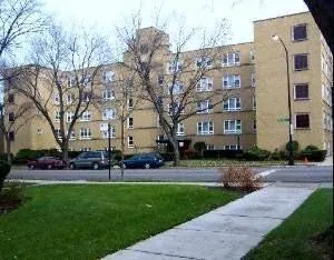 a view of a building with a yard