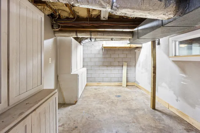 a view of empty room with wooden walls