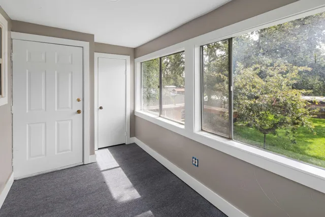 a view of an empty room with a window