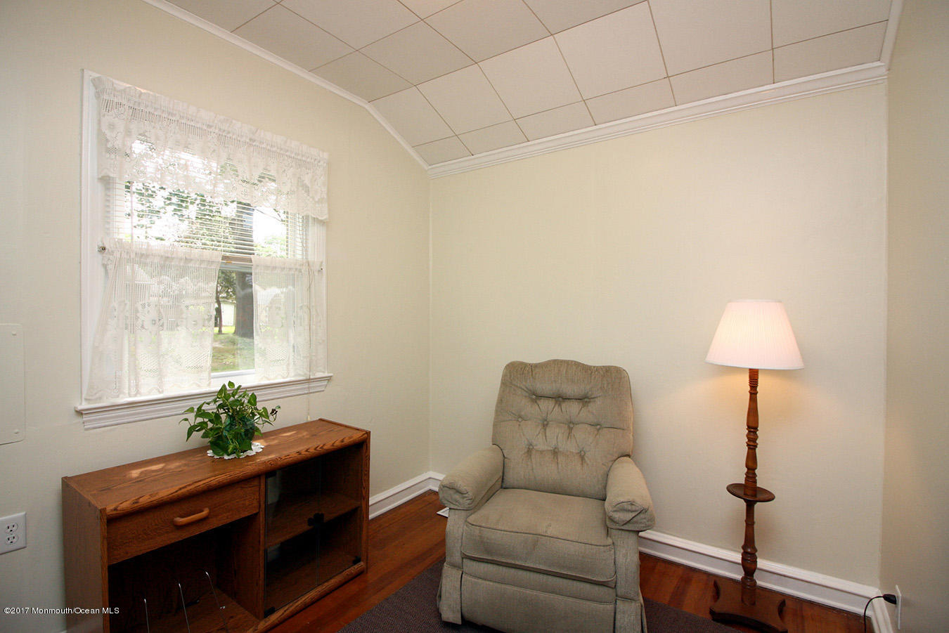 464 Georgia Tavern Road Howell, NJ 07731 - Photo 4 of 17 a living room with furniture a lamp and a window