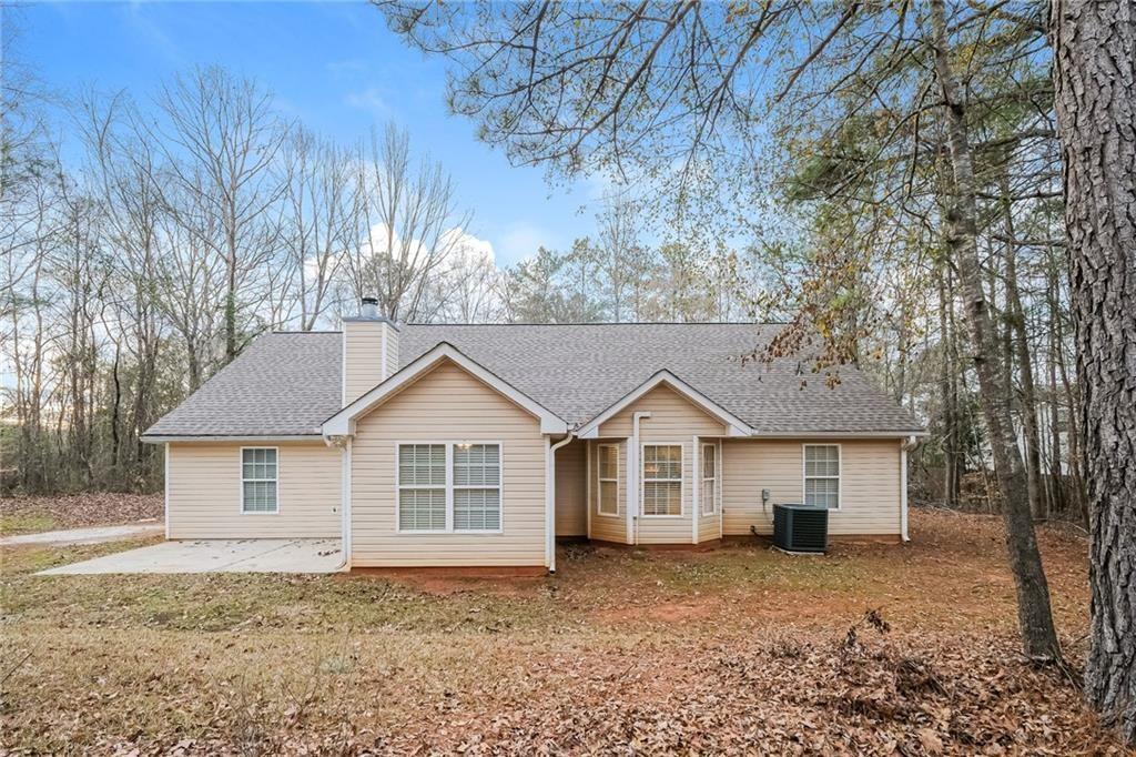 75 Pebble Crossing Covington, GA 30016 - Photo 26 of 27 a view of a house with a yard and large tree