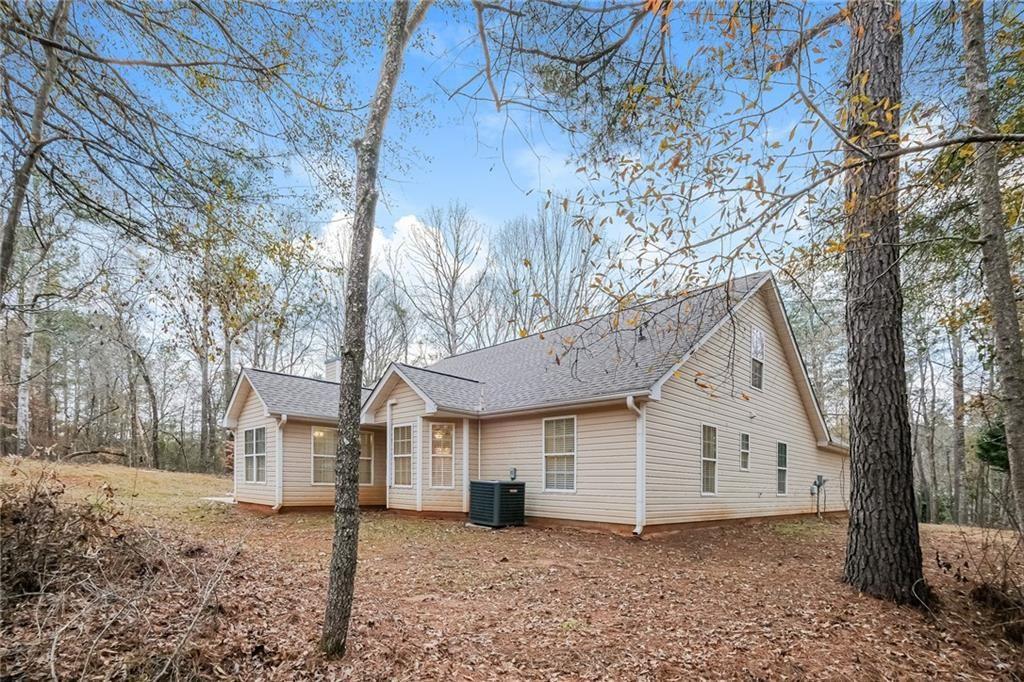 75 Pebble Crossing Covington, GA 30016 - Photo 27 of 27 a view of a house with a yard and large tree
