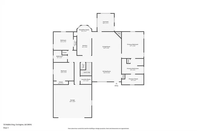 an empty room with wooden floor and a fireplace