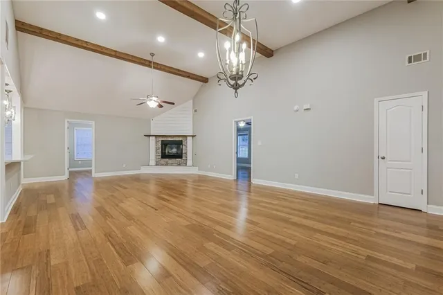 a large kitchen with kitchen island a sink stainless steel appliances and cabinets