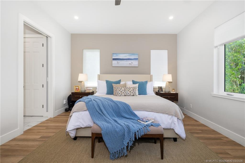 5169 Southeast Horseshoe Point Road Stuart, FL 34997 - Photo 17 of 54 a bedroom with bed and a window