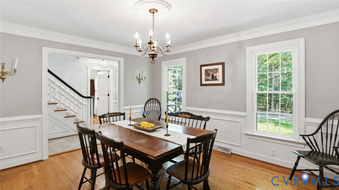 10716 Chalkley Road Richmond, VA 23237 - Photo 11 of 46 a view of a dining room with furniture window and wooden floor