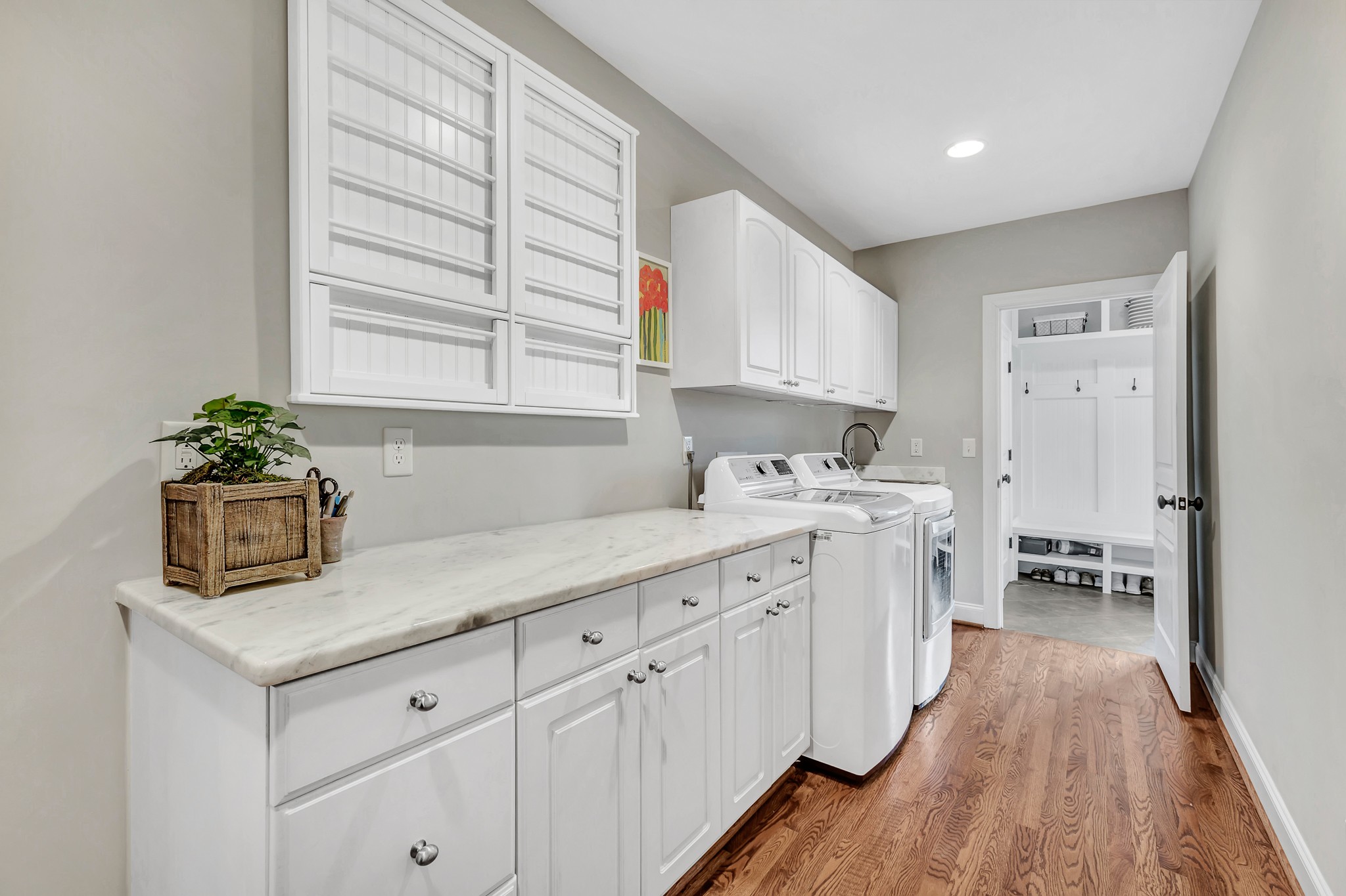 4028 Aberdeen Road Nashville, TN 37205 - Photo 19 of 41 a kitchen that has a lot of white cabinets and wooden floor