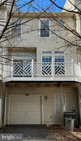 a front view of a building with parking space