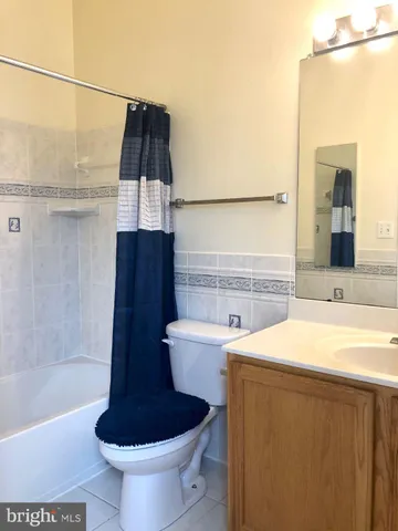 a bathroom with a sink a toilet and bathtub