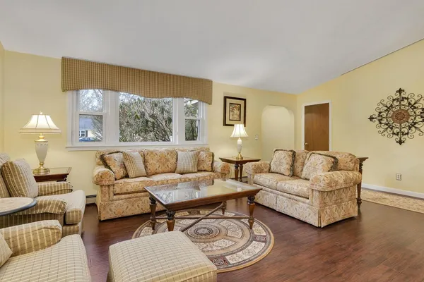 a living room with furniture and a large window