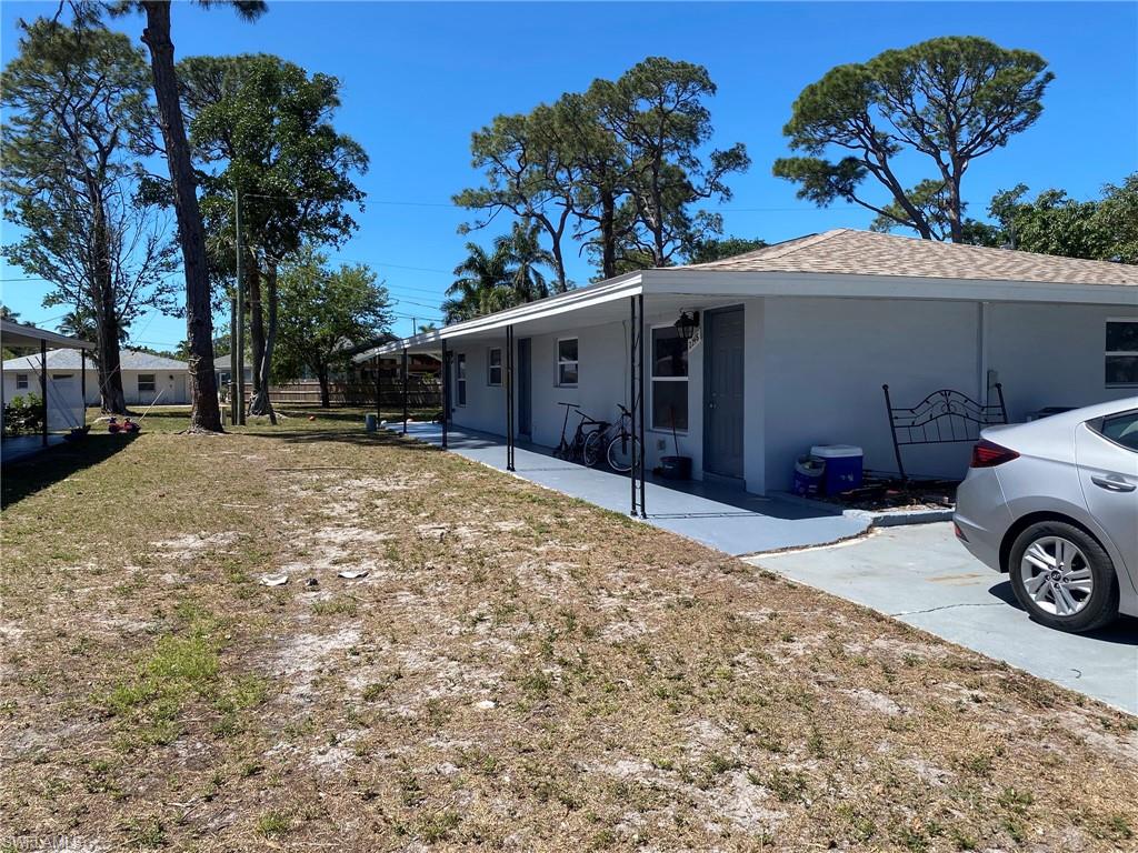 2264 Washington Avenue Naples, FL 34112 - Photo 3 of 5 a view of a house with a yard covered in snow