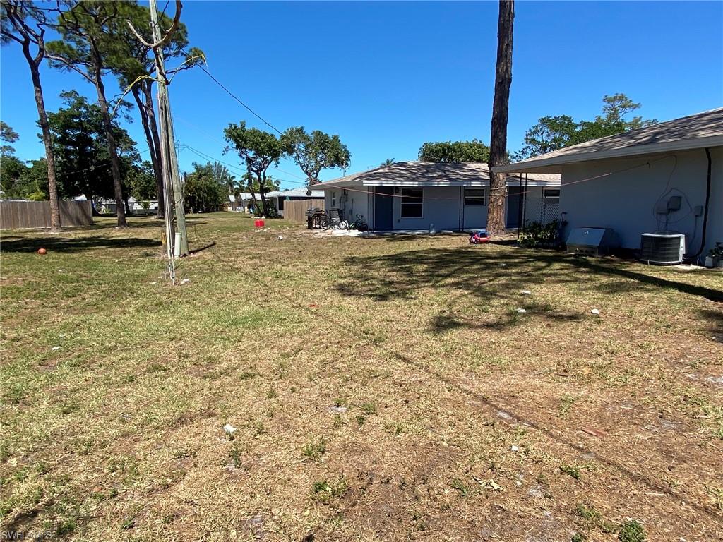 2264 Washington Avenue Naples, FL 34112 - Photo 4 of 5 a front view of a house with a yard