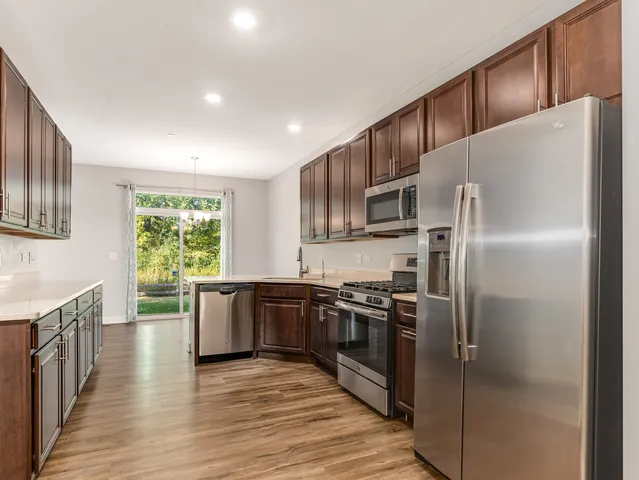 a kitchen with a sink and cabinets