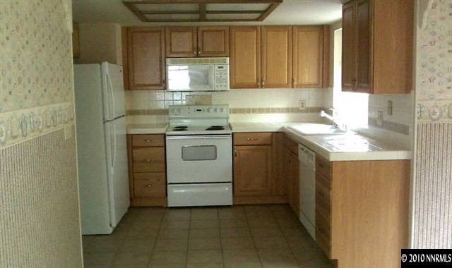 4309 Pescado Way Reno, NV 89502 - Photo 4 of 9 a kitchen with a sink stove and cabinets