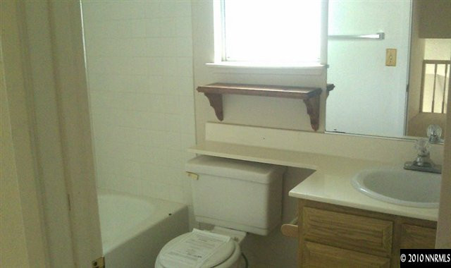 4309 Pescado Way Reno, NV 89502 - Photo 6 of 9 a bathroom with a sink toilet and mirror