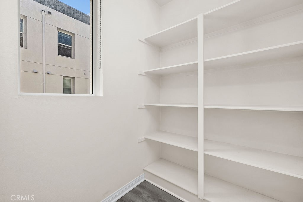 159 Steely Irvine, CA 92614 - Photo 9 of 30 Walk-in pantry with built-in shelving providing excellent storage.