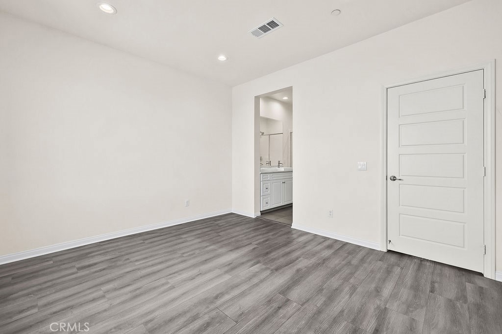 159 Steely Irvine, CA 92614 - Photo 13 of 30 Primary bedroom showcasing en-suite access and clean, contemporary design.