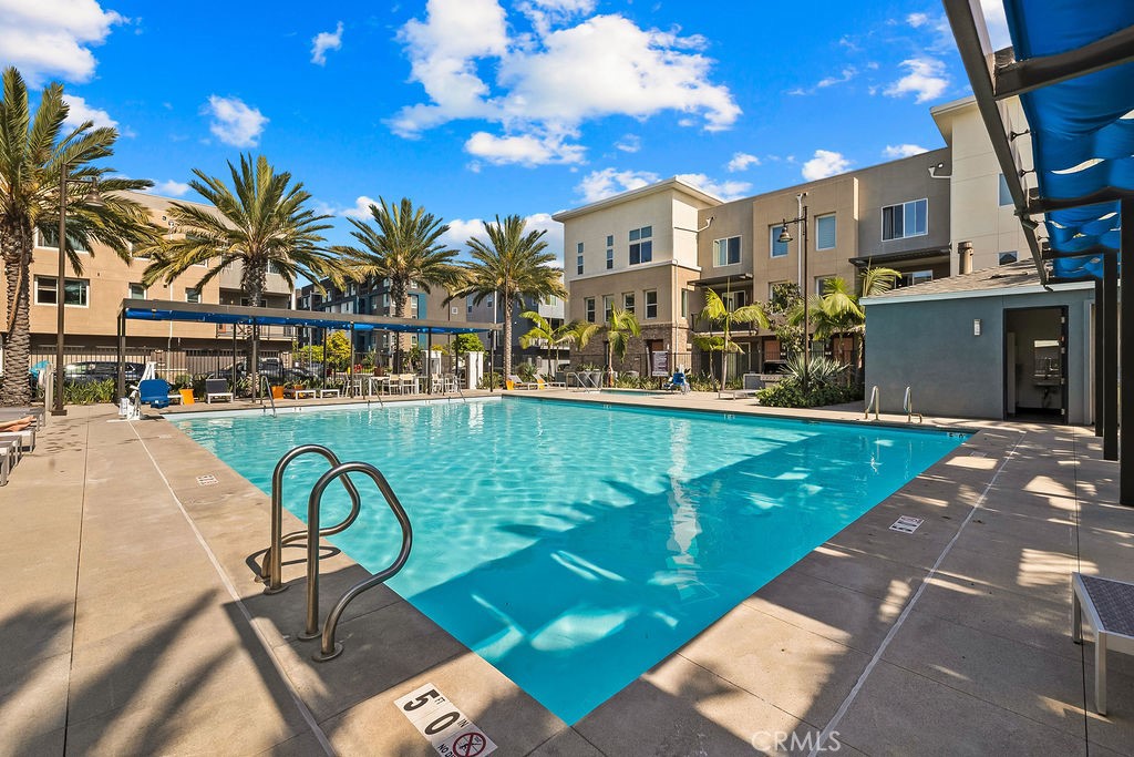 159 Steely Irvine, CA 92614 - Photo 24 of 30 Resort-style pool area with palm trees and ample lounge space.