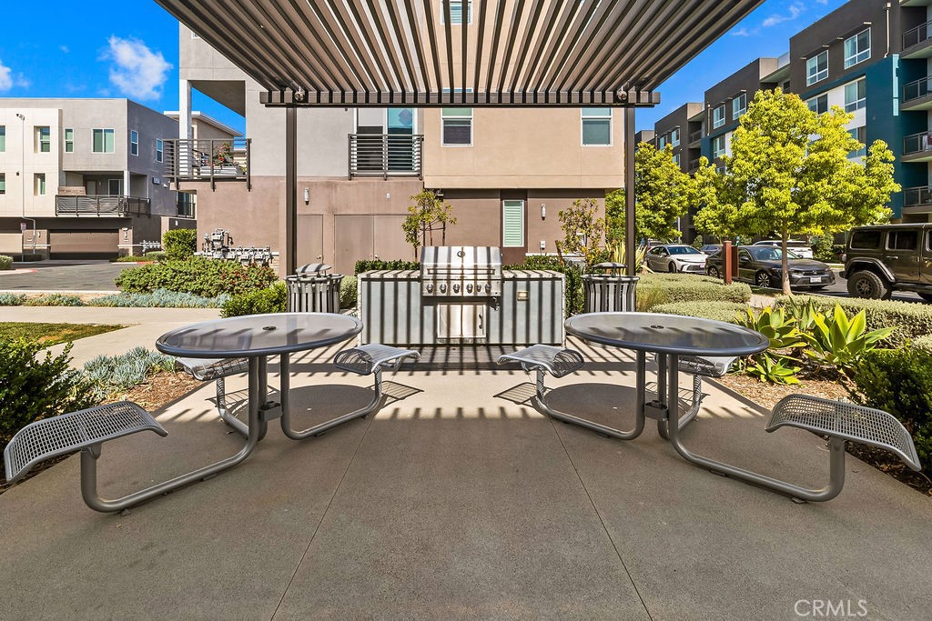 159 Steely Irvine, CA 92614 - Photo 25 of 30 Community outdoor seating and picnic area with shaded structure.