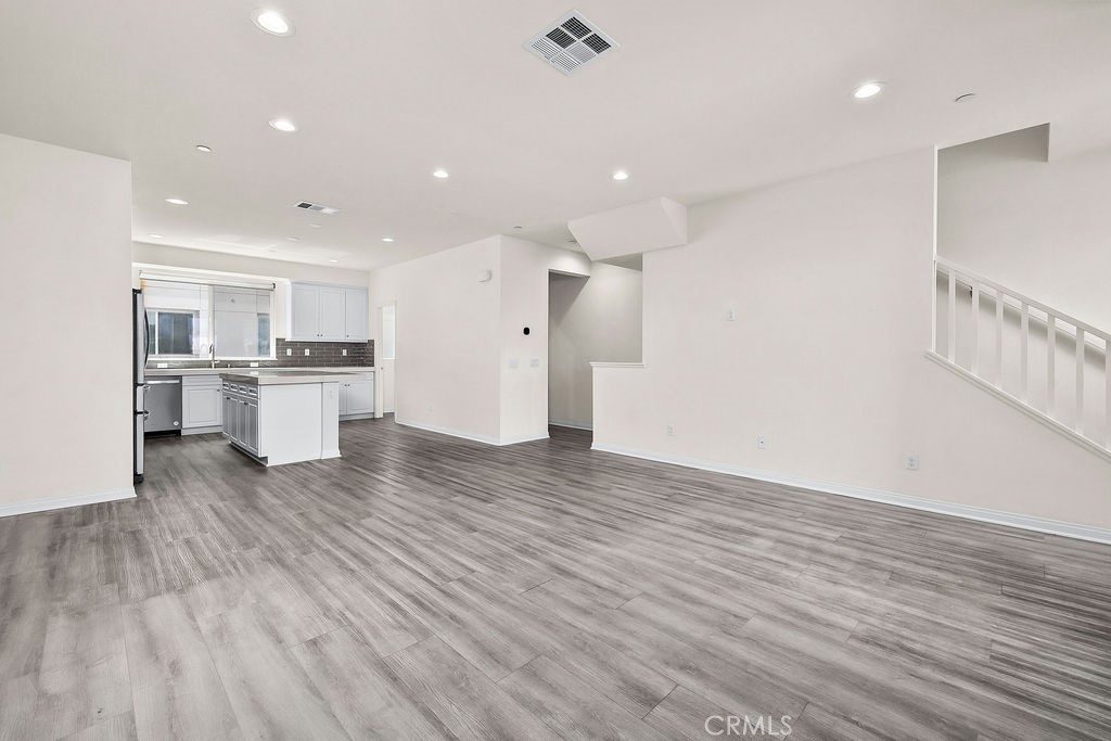 159 Steely Irvine, CA 92614 - Photo 8 of 30 Spacious main living area with open layout connecting kitchen, dining, and living spaces.