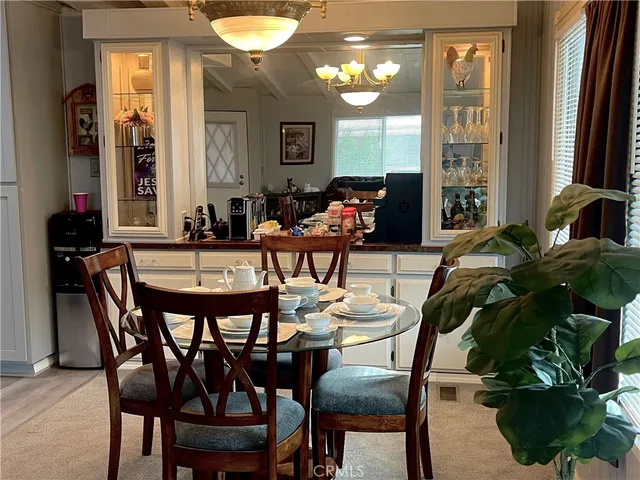a dining room with furniture and window