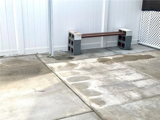 a view of a bench in the backyard