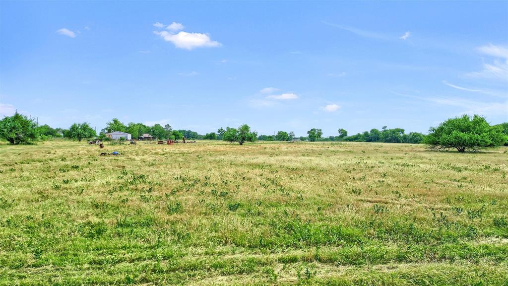 1730 Mackey Road Gunter, TX 75058 - Photo 12 of 21 a view of a big yard with a house in the background