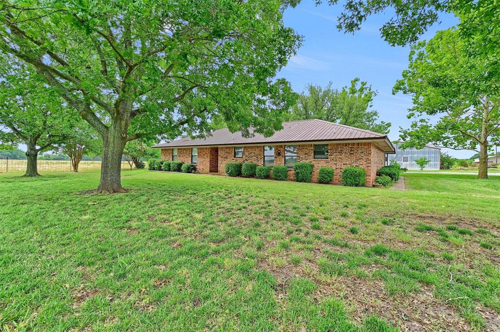 1730 Mackey Road Gunter, TX 75058 - Photo 17 of 21 a view of a house with a yard