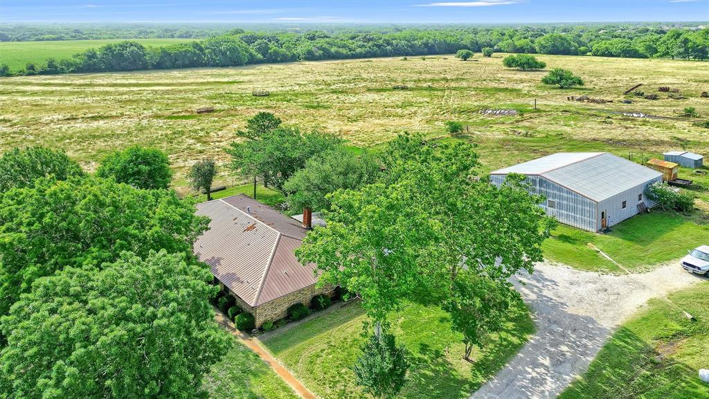 1730 Mackey Road Gunter, TX 75058 - Photo 2 of 21 an aerial view of a house with a garden and lake view