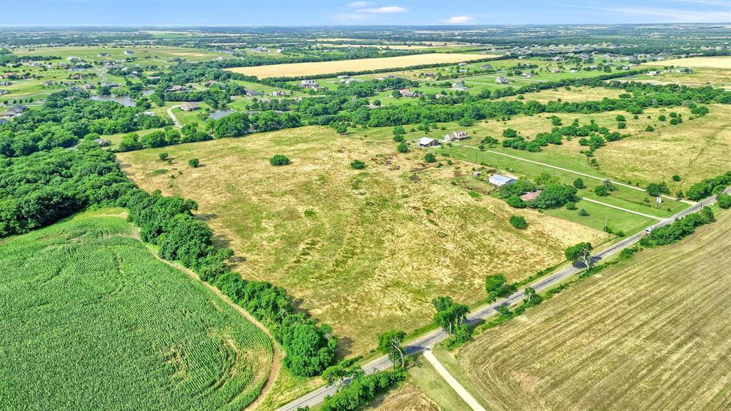 1730 Mackey Road Gunter, TX 75058 - Photo 7 of 21 a view of a green field with an ocean view
