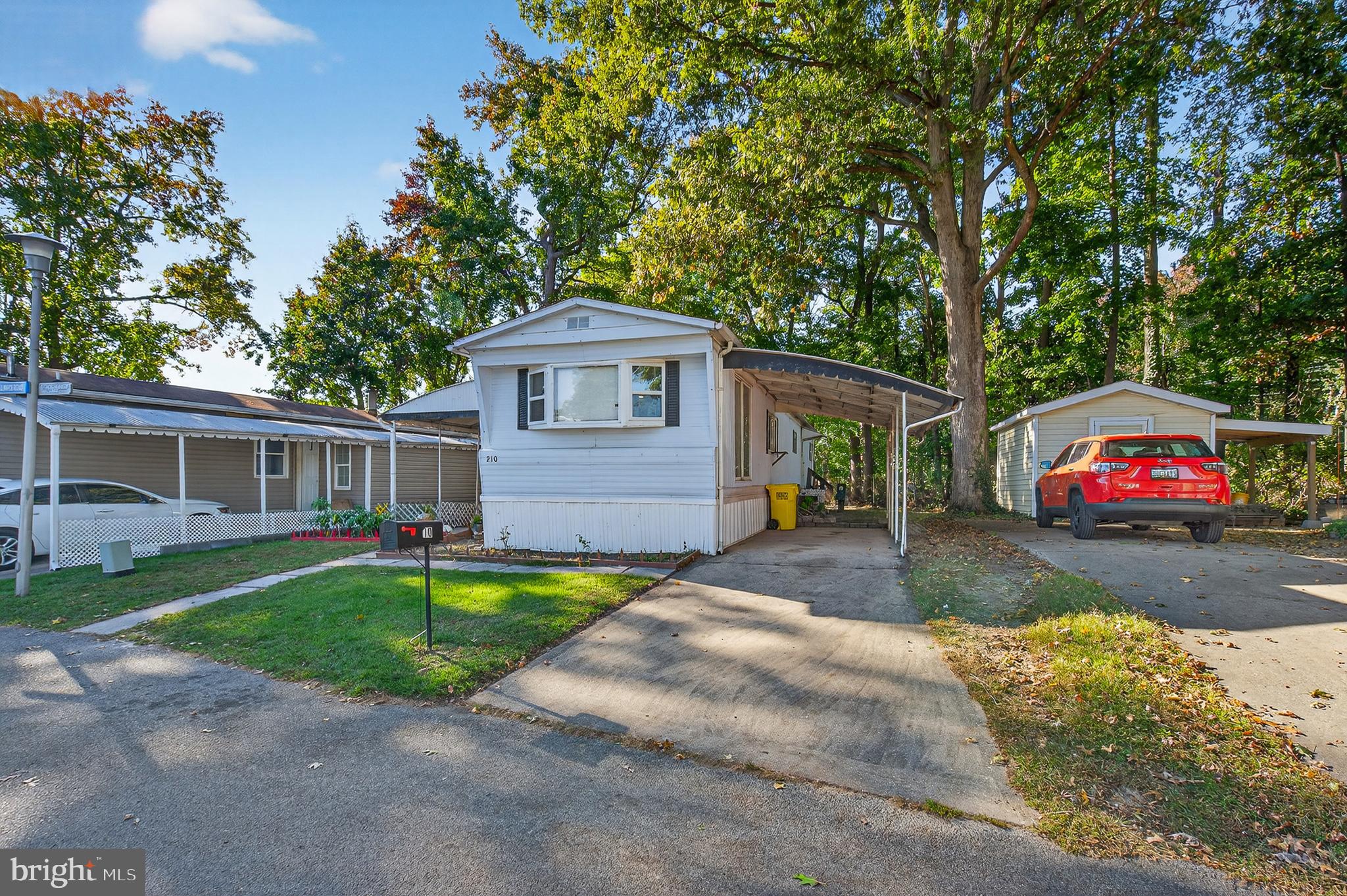 210 Trailway Road Middle River, MD 21220 - Photo 1 of 17 a front view of a house with a yard and garage