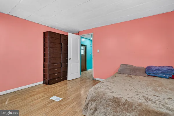 a view of wooden floor and windows in a room
