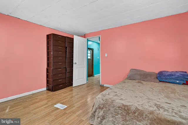 a view of wooden floor and windows in a room