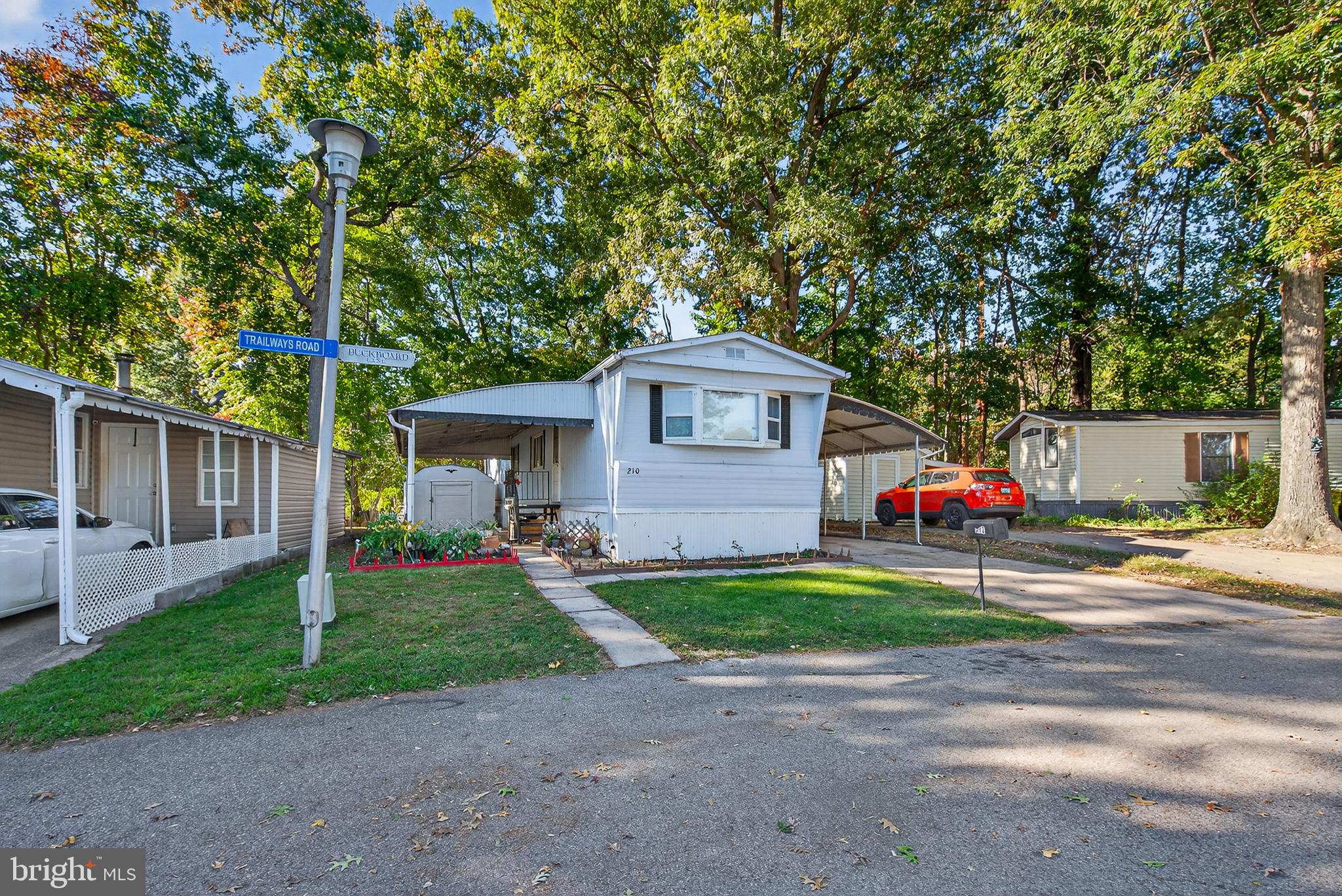 210 Trailway Road Middle River, MD 21220 - Photo 2 of 17 a front view of a house with a yard and garage