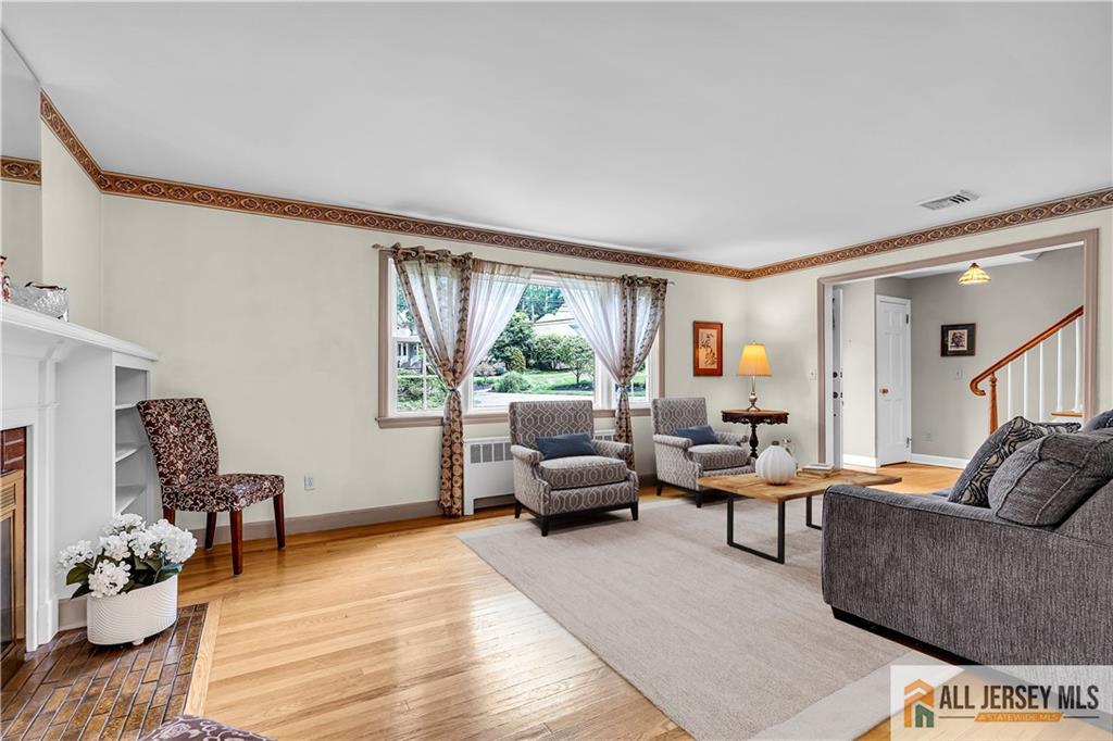 20 Oak Hills Road Edison, NJ 08820 - Photo 12 of 41 a living room with furniture and a large window