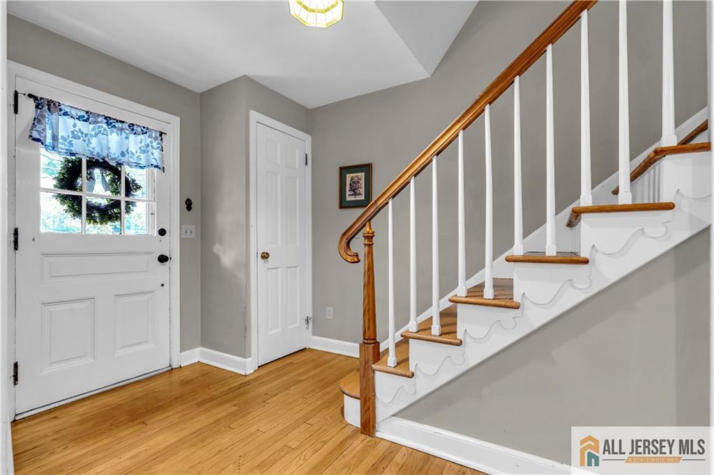 20 Oak Hills Road Edison, NJ 08820 - Photo 20 of 41 a view of an entryway with wooden floor and stairs