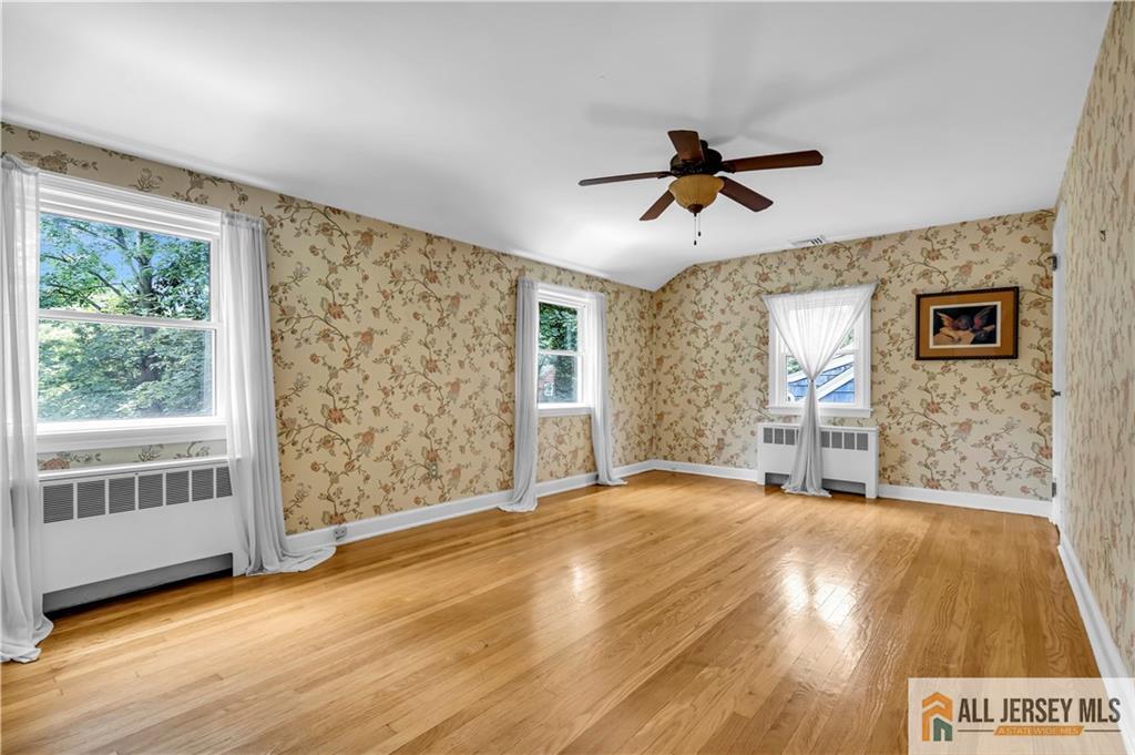 20 Oak Hills Road Edison, NJ 08820 - Photo 25 of 41 a view of a livingroom with a ceiling fan and window