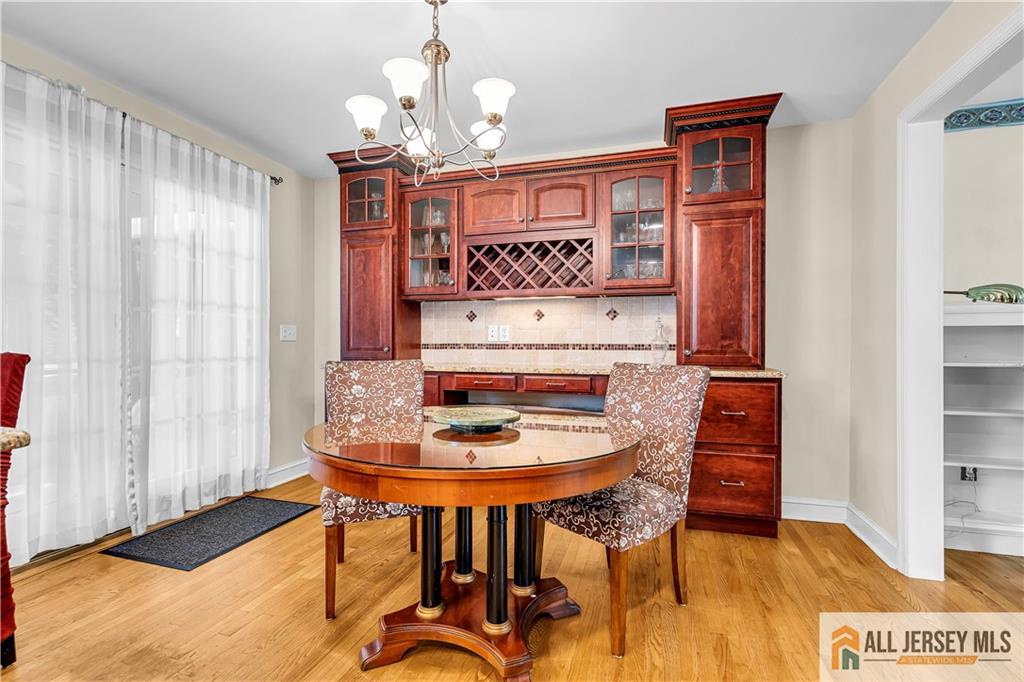 20 Oak Hills Road Edison, NJ 08820 - Photo 5 of 41 a view of a dining room with furniture and wooden floor